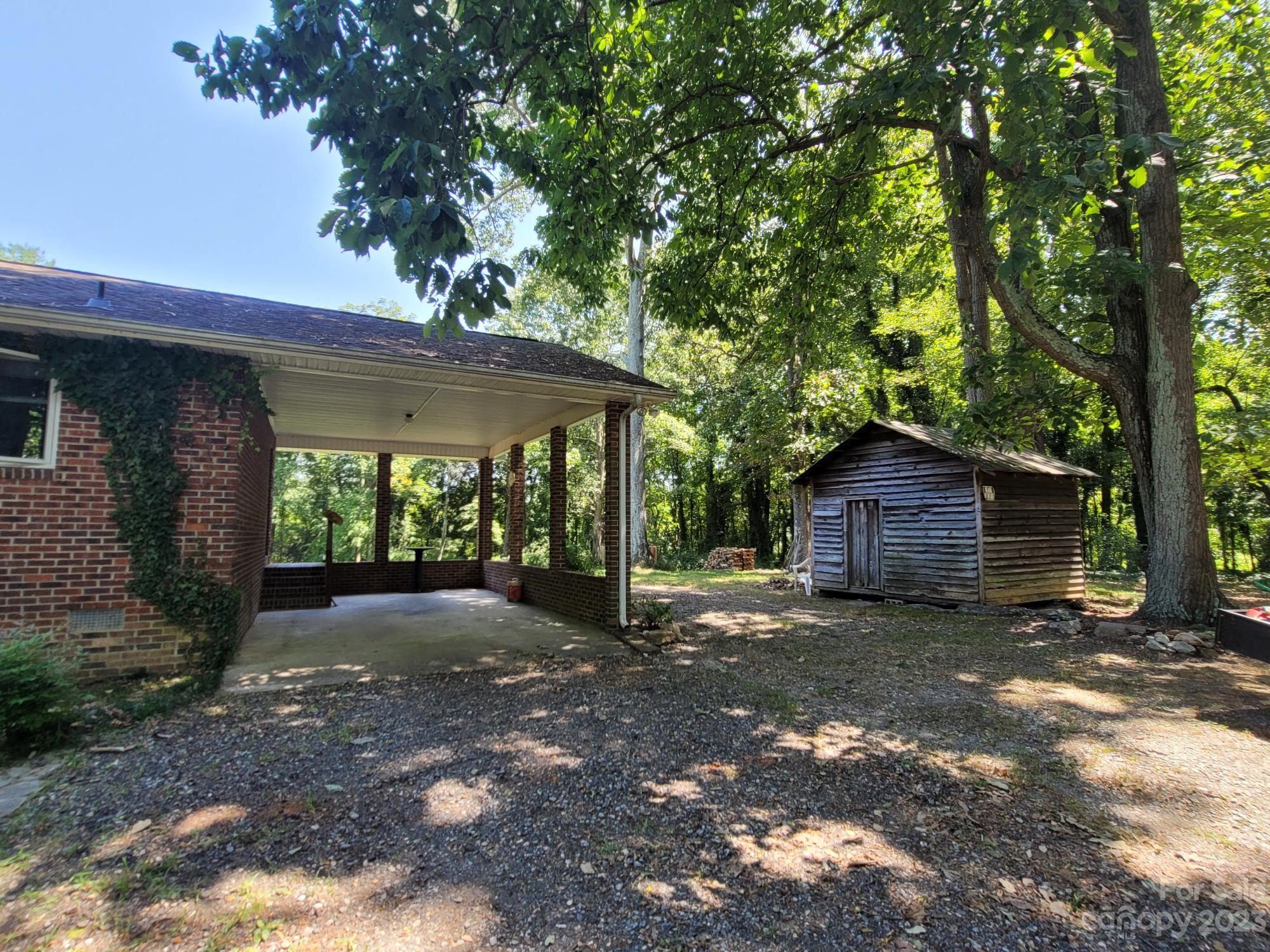 818 St Marks Church Road Bessemer City, NC 28016 - Photo 5 of 48 a view of a house with a tree in the background