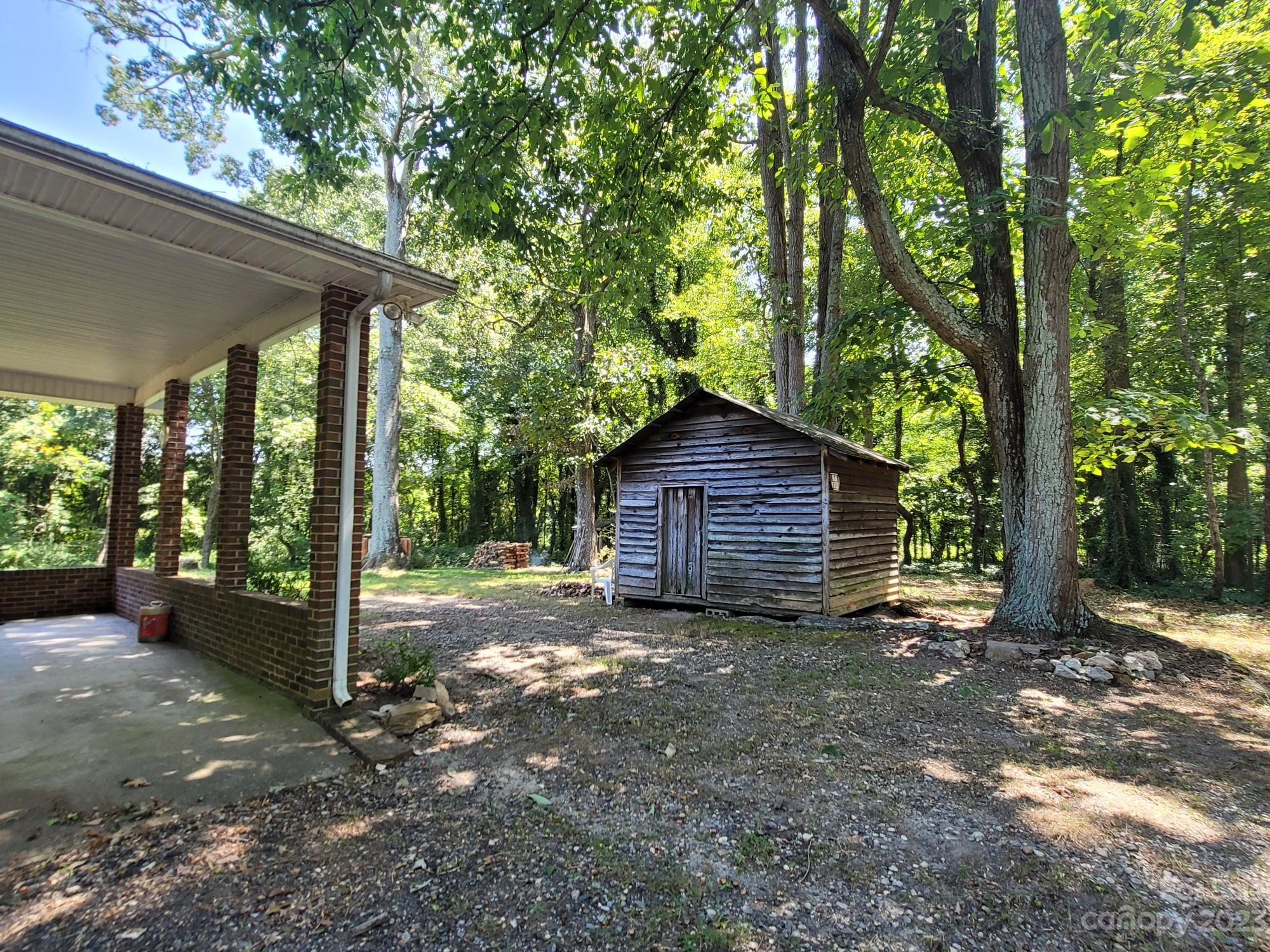 818 St Marks Church Road Bessemer City, NC 28016 - Photo 6 of 48 a view of a house with a yard