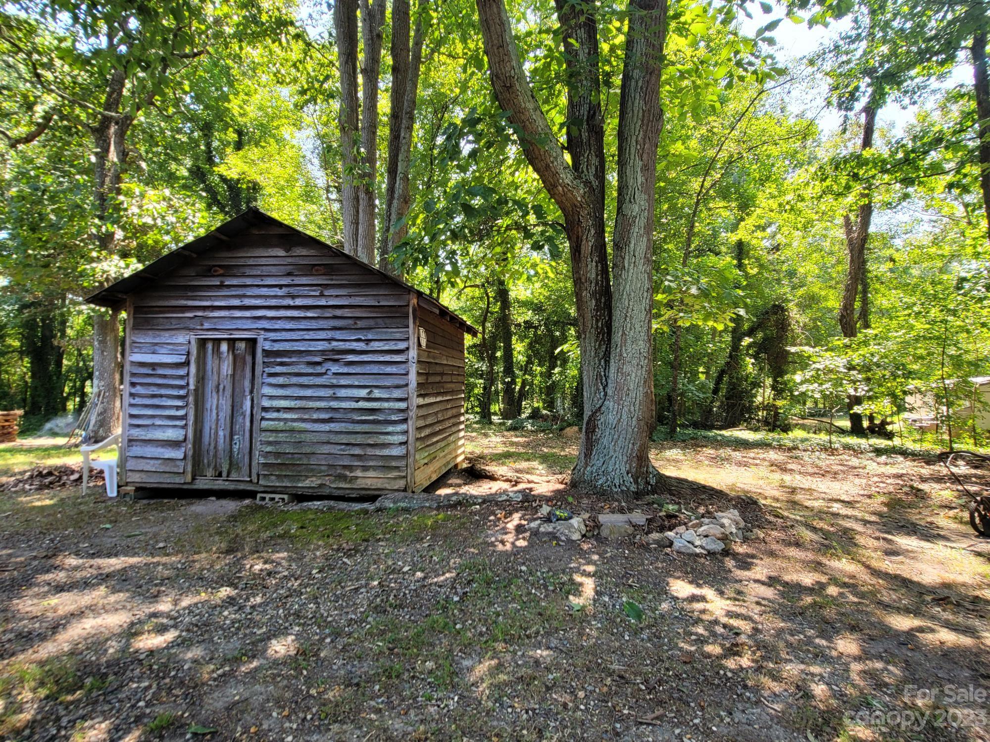 818 St Marks Church Road Bessemer City, NC 28016 - Photo 7 of 48 a front view of a house with a yard