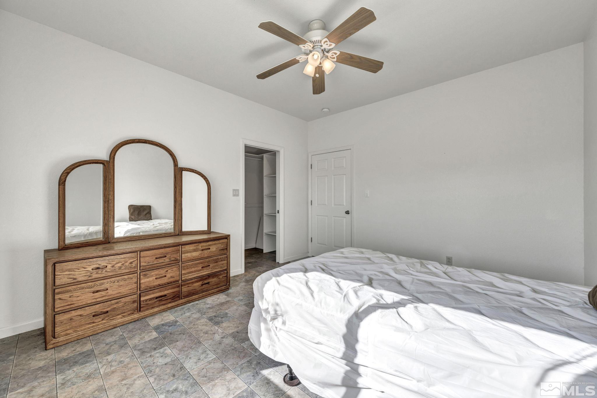88 Smith Gage Road Smith, NV 89430 - Photo 13 of 40 a bedroom with a bed and a dresser