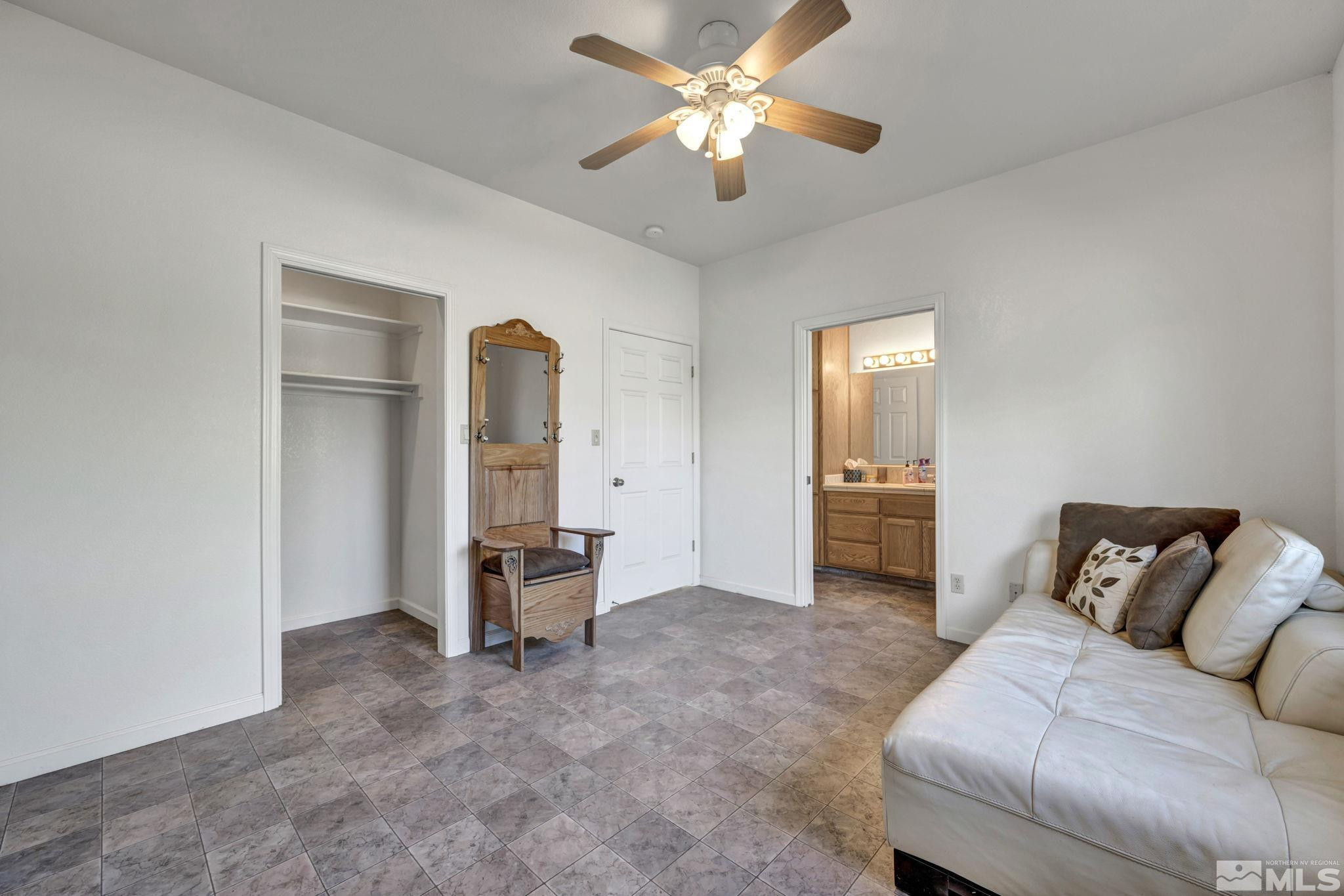 88 Smith Gage Road Smith, NV 89430 - Photo 15 of 40 a living room with furniture and a ceiling fan