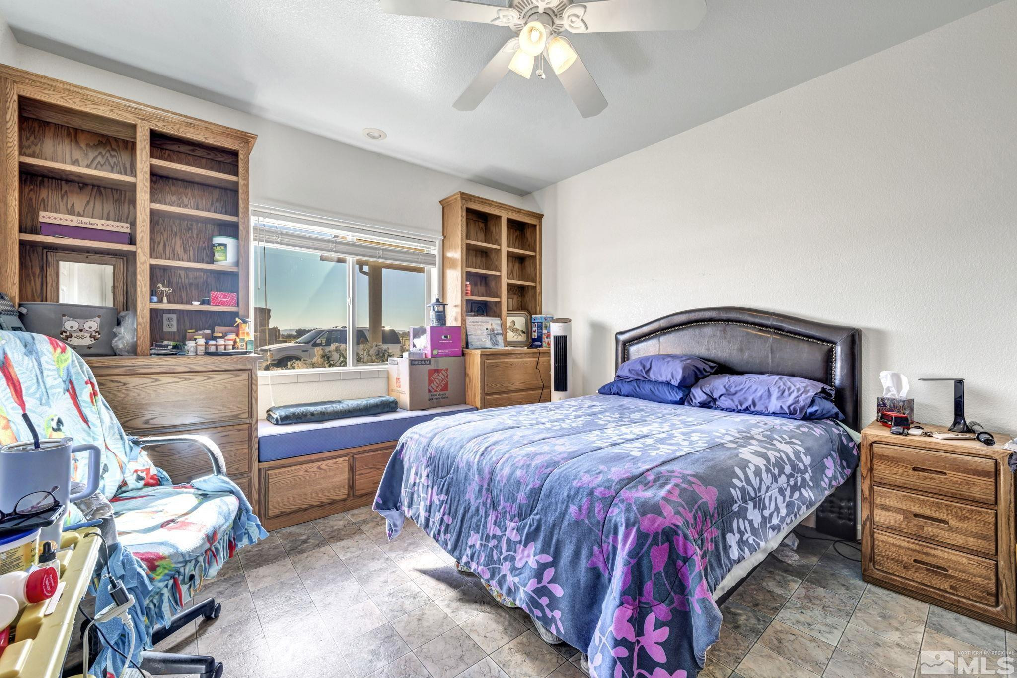 88 Smith Gage Road Smith, NV 89430 - Photo 17 of 40 a bedroom with a bed and wooden floor