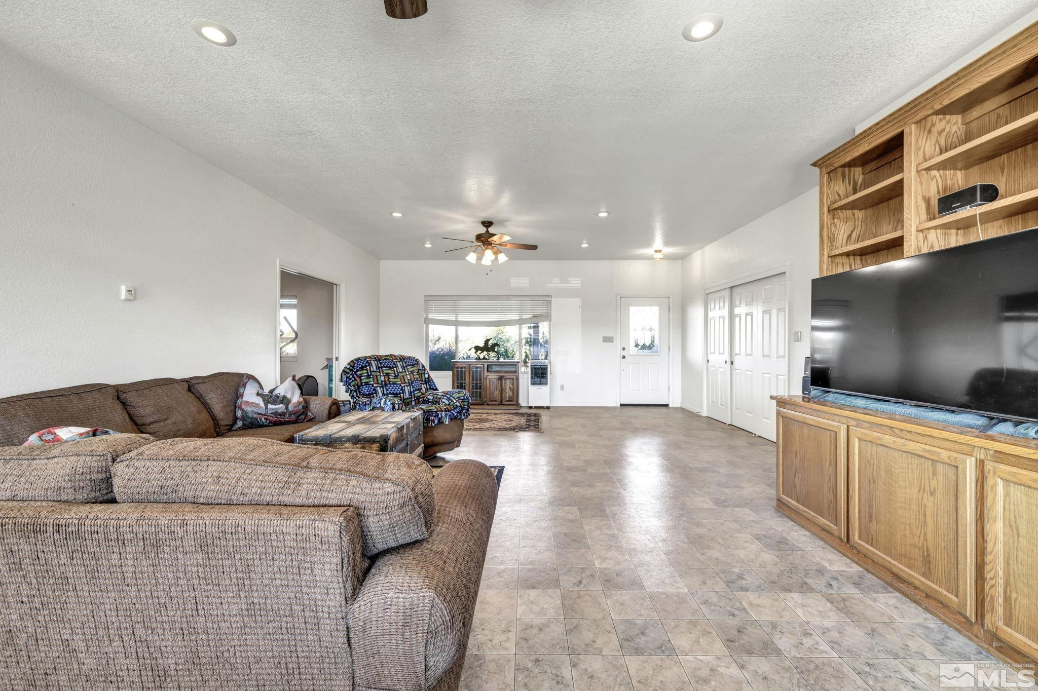 88 Smith Gage Road Smith, NV 89430 - Photo 5 of 40 a living room with furniture and a wooden floor