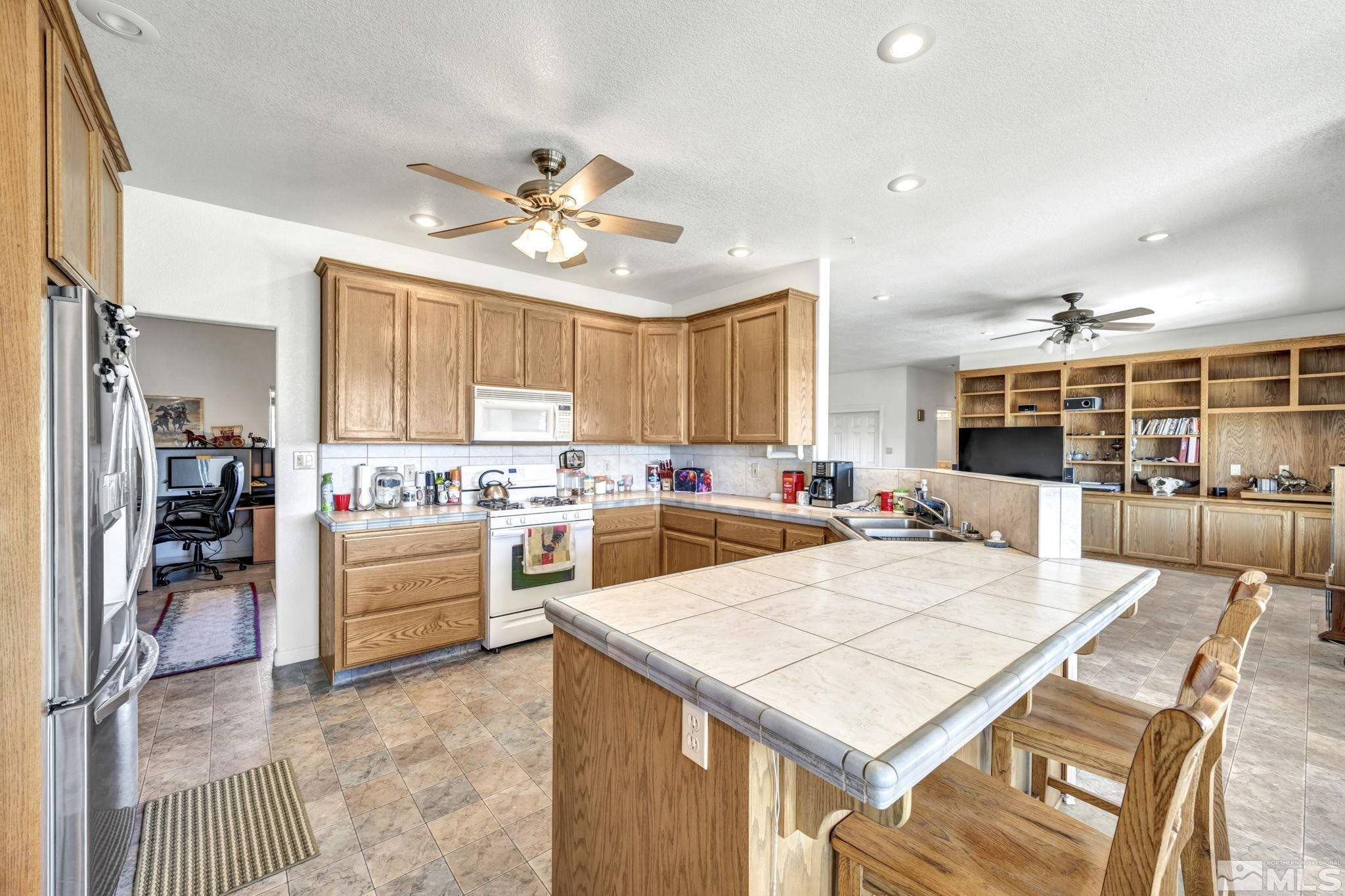 88 Smith Gage Road Smith, NV 89430 - Photo 9 of 40 a large kitchen with a table and chairs