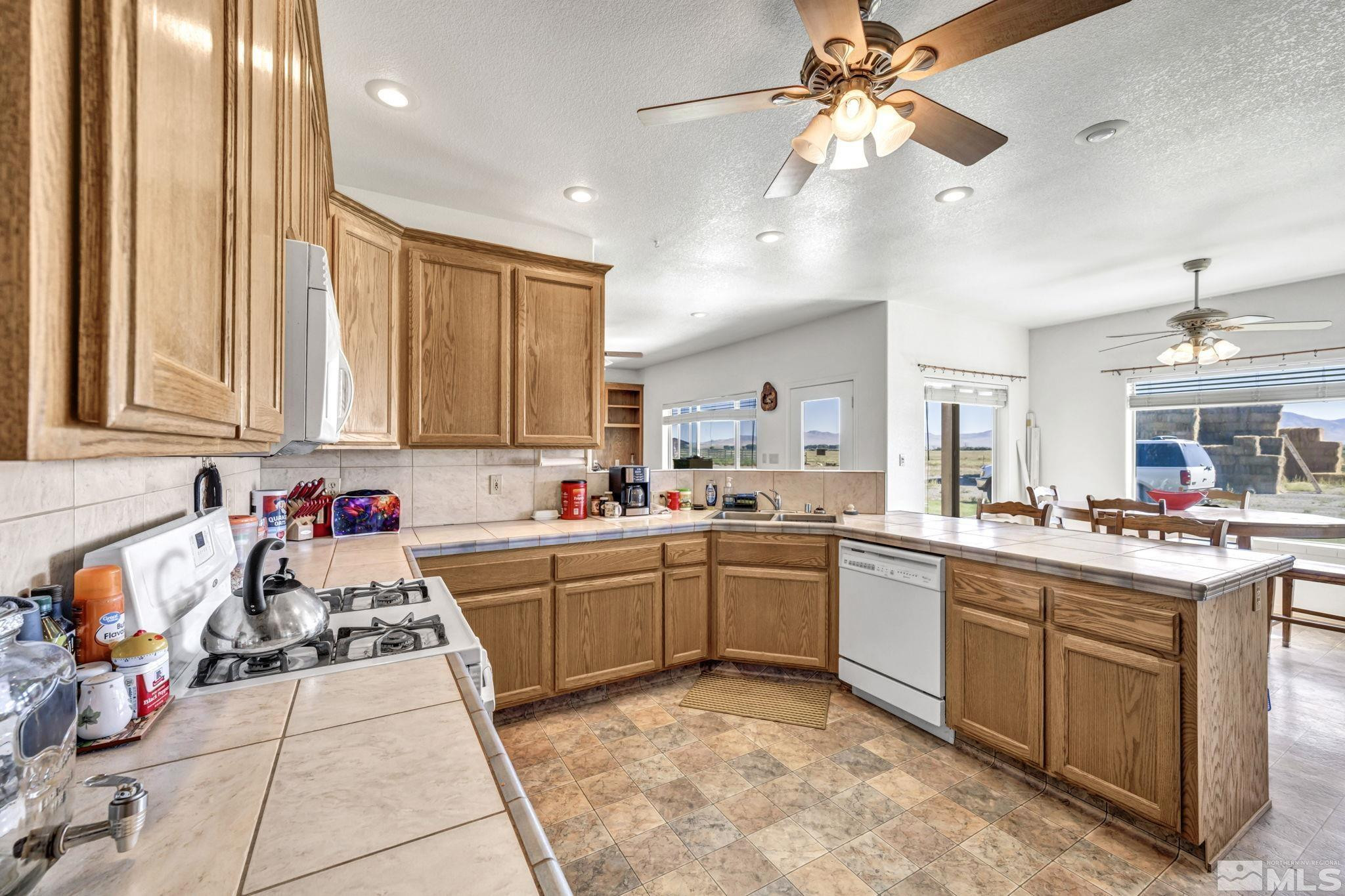 88 Smith Gage Road Smith, NV 89430 - Photo 10 of 40 a kitchen with a sink and cabinets