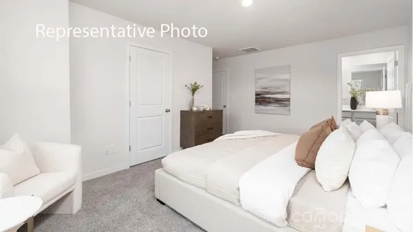 a bedroom with a bed and a couch