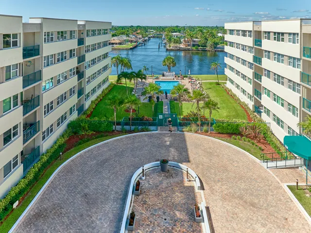 a view of a swimming pool and a yard