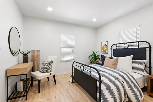 a bedroom with a bed and a lamp