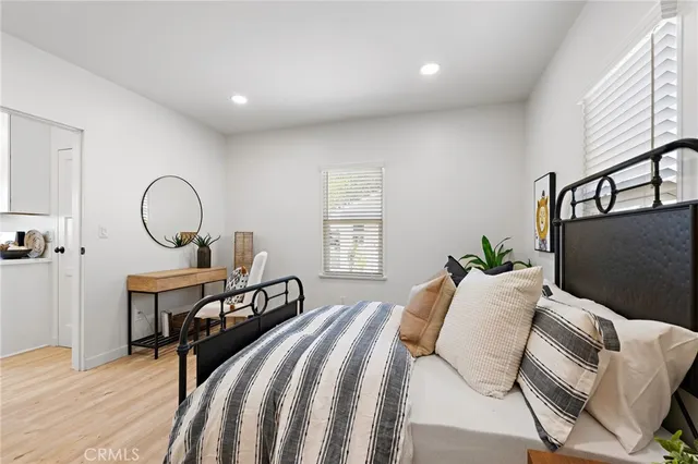 a bedroom with double bed and a window