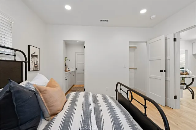 a bedroom with a bed and a chair