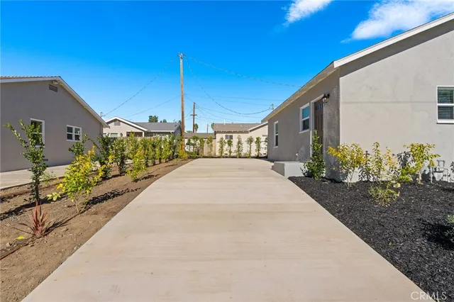 a front view of a house with swimming pool having outdoor seating