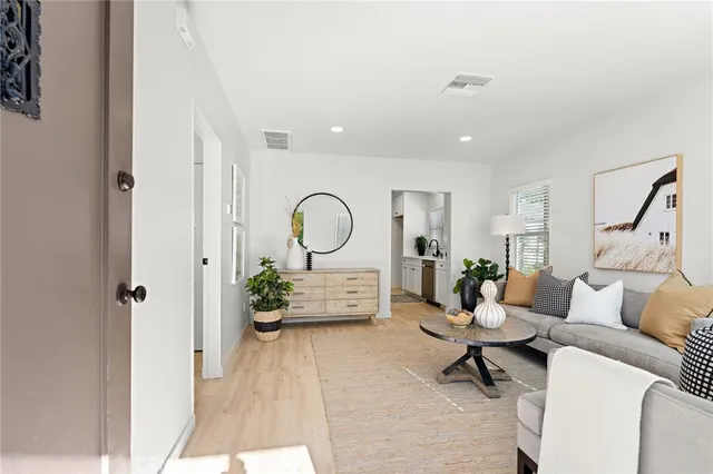 a bedroom with a bed and a potted plant