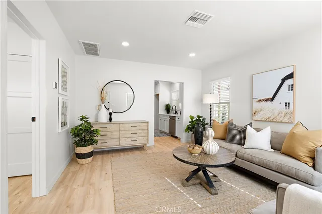 a very nice looking room with a large window and chandelier