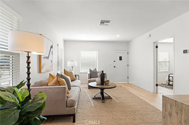 a spacious bedroom with a bed and a couch