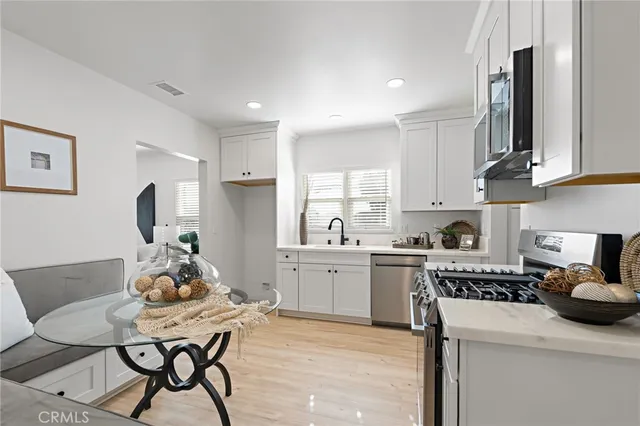 a view of staircase with white walls and window