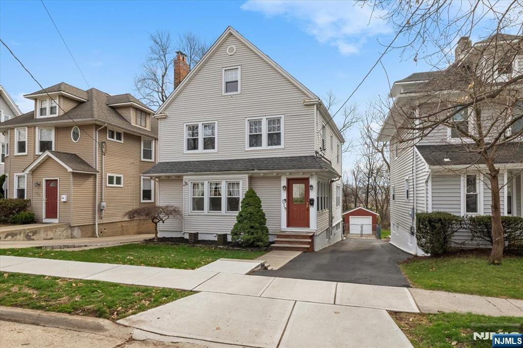 119 Overpeck Avenue Ridgefield Park, NJ 07660 - Photo 2 of 44 a front view of a house with garden