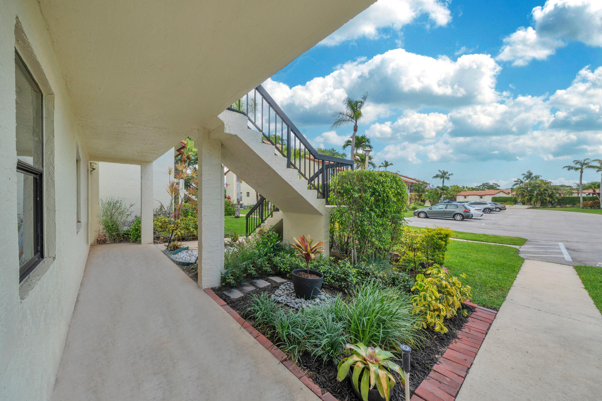 22136 Palms Way, Unit 103 Boca Raton, FL 33433 - Photo 36 of 42 a view of a garden