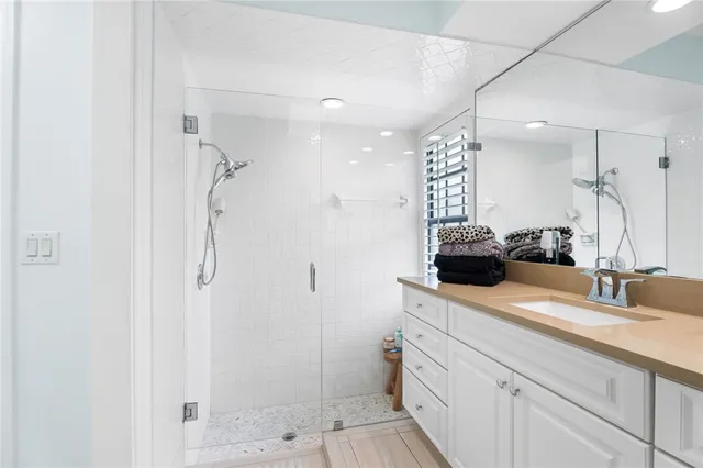 a bathroom with a sink double vanity and shower