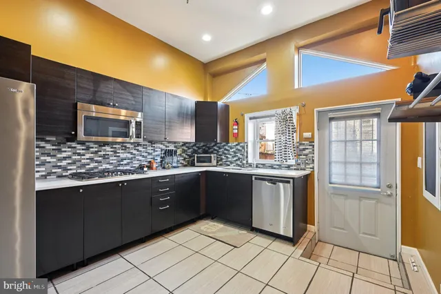 a large bathroom with a sink and a large mirror