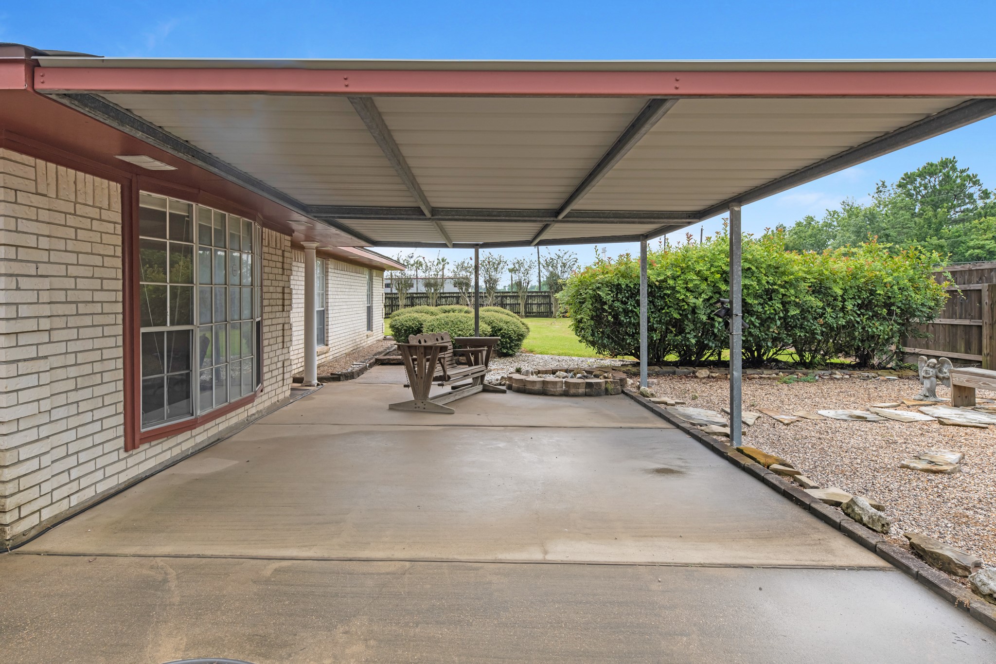 7315 Pine Street Manvel, TX 77578 - Photo 16 of 50 a patio with yard glass top table and chairs