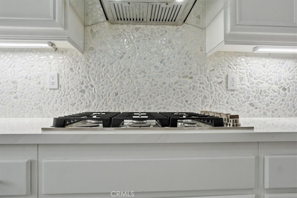 13525 Aspen Grove Road Eastvale, CA 92880 - Photo 12 of 29 IRIDESCENT BACKSPLASH & UNDER CAB LIGHTS
