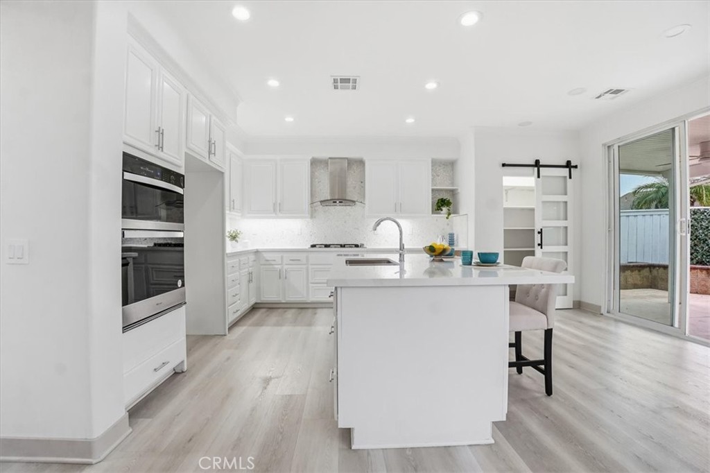 13525 Aspen Grove Road Eastvale, CA 92880 - Photo 9 of 29 GOURMET KITCHEN WITH WALK IN PANTRY