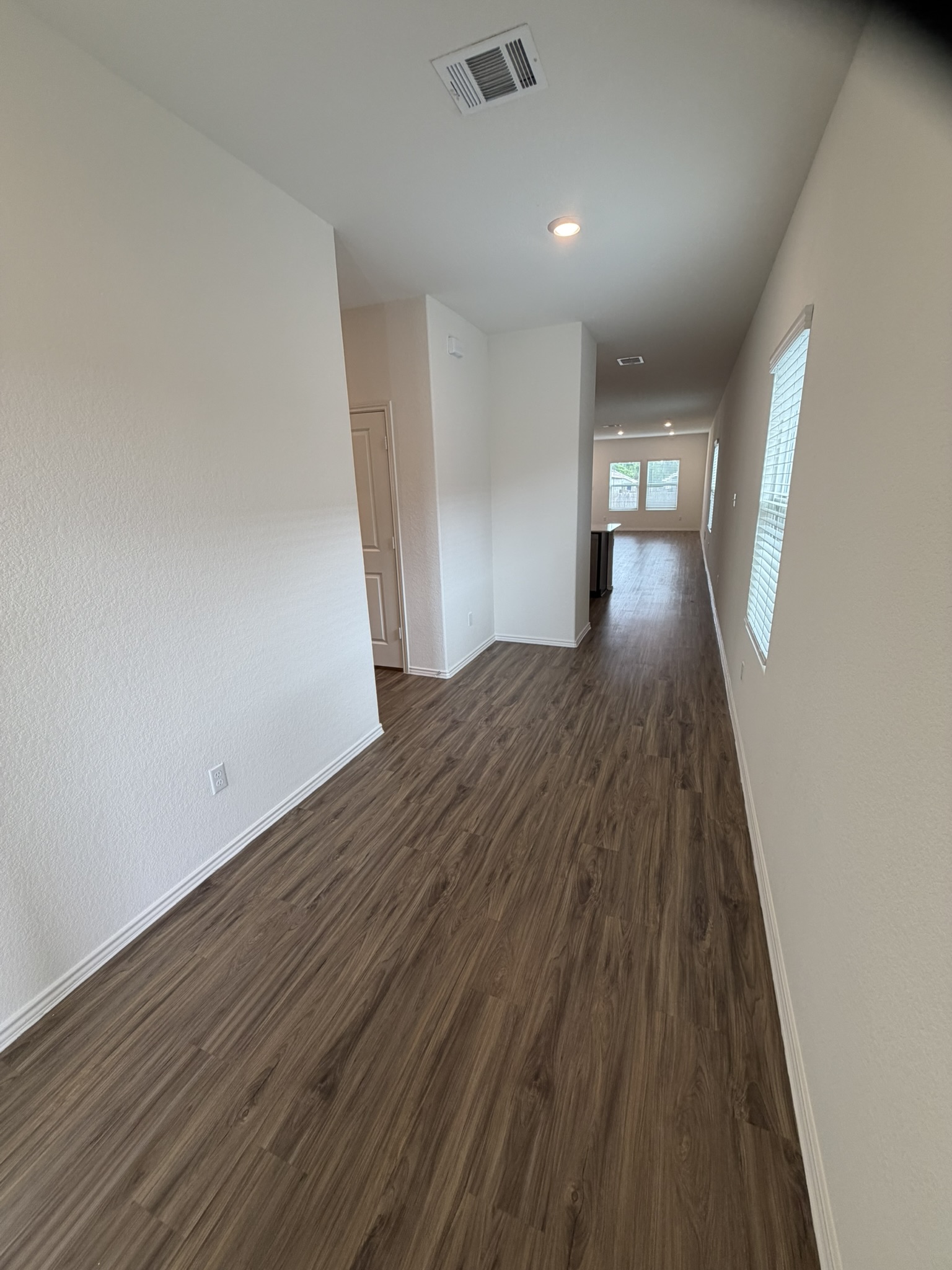 408 Buckners Street Georgetown, TX 78626 - Photo 2 of 15 a view of empty room with wooden floor