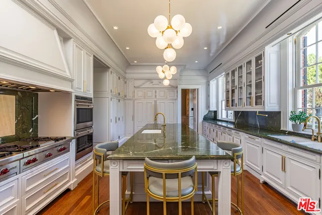 a bathroom with a sink and a large mirror