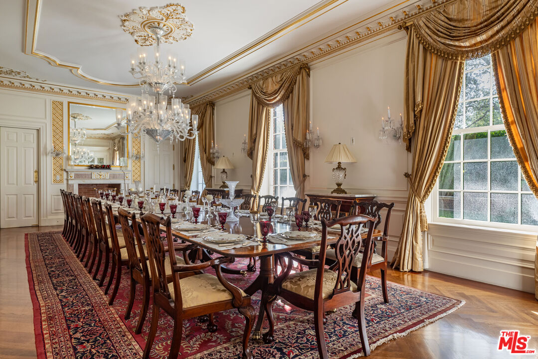 500 St Cloud Road Los Angeles, CA 90077 - Photo 12 of 59 a view of a dining room with furniture and chandelier