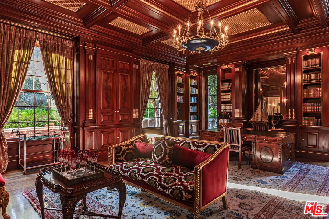 500 St Cloud Road Los Angeles, CA 90077 - Photo 15 of 59 a living room with furniture a bed and a chandelier