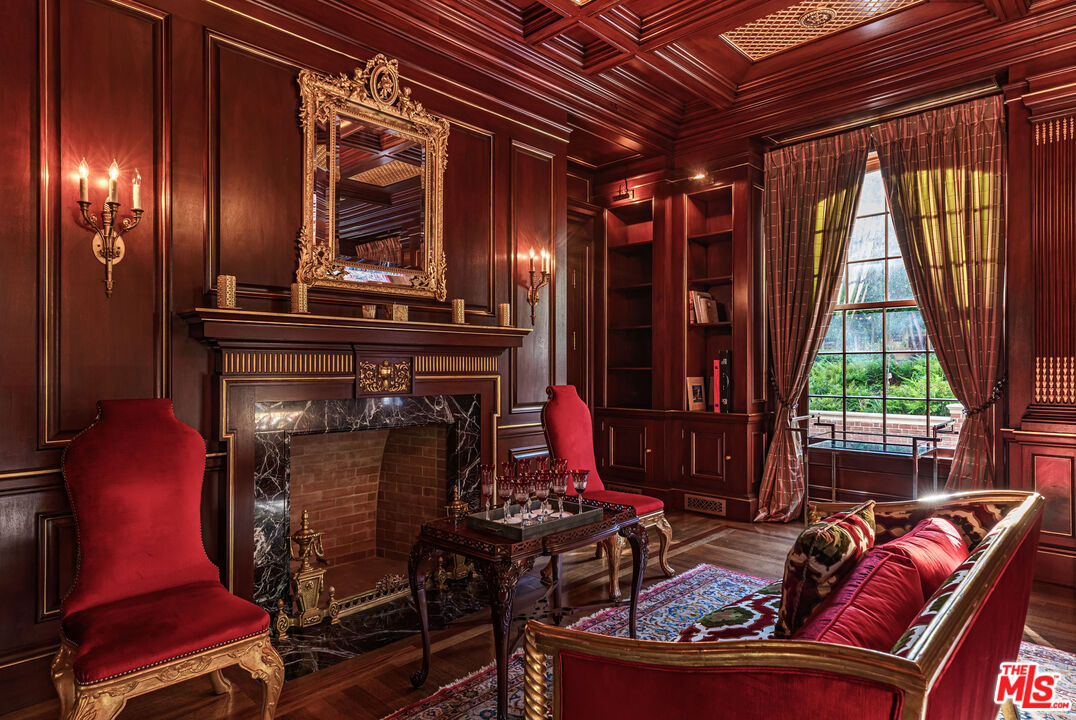 500 St Cloud Road Los Angeles, CA 90077 - Photo 16 of 59 a living room with furniture and a fireplace