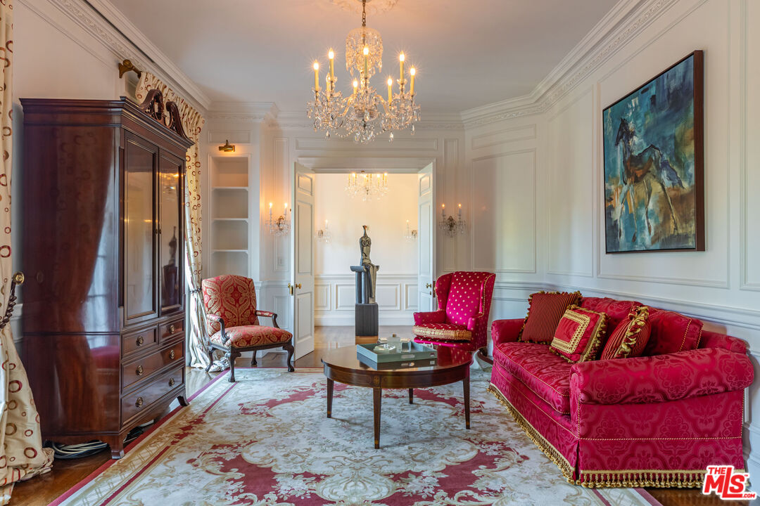 500 St Cloud Road Los Angeles, CA 90077 - Photo 18 of 59 a living room with furniture a chandelier and a dining table