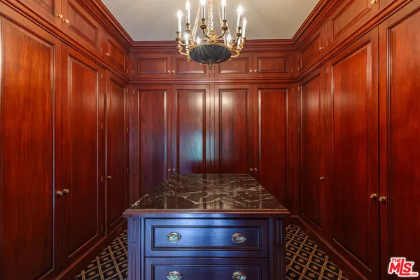 a bathroom with a granite countertop sink mirror and a bath tub