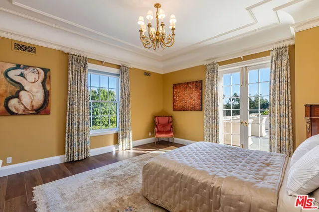 a living room with furniture chandelier and a chandelier