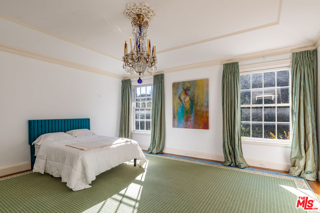 500 St Cloud Road Los Angeles, CA 90077 - Photo 28 of 59 a bed sitting in a bedroom next to a window