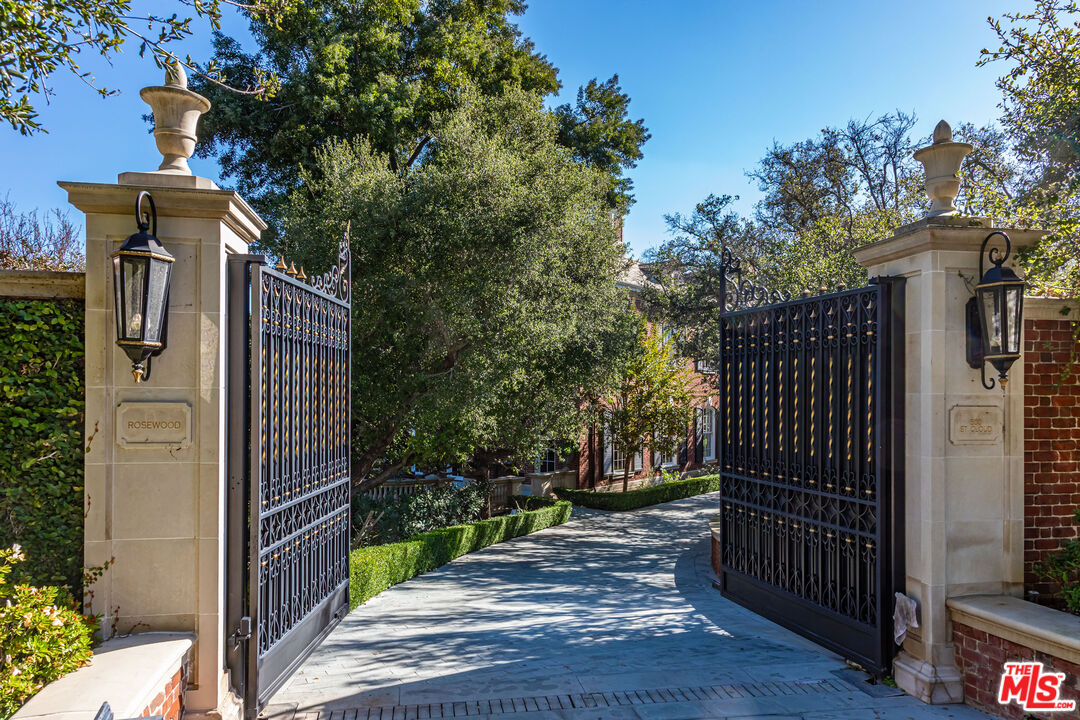 500 St Cloud Road Los Angeles, CA 90077 - Photo 3 of 59 a view of a pathway of a building with wooden fence