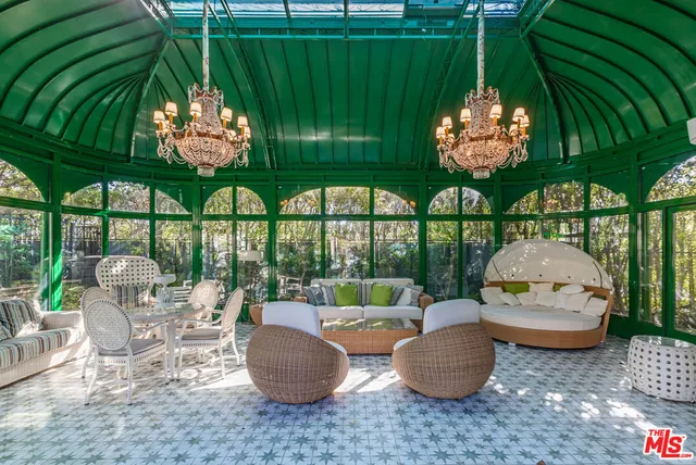 a room with lots of furniture and window