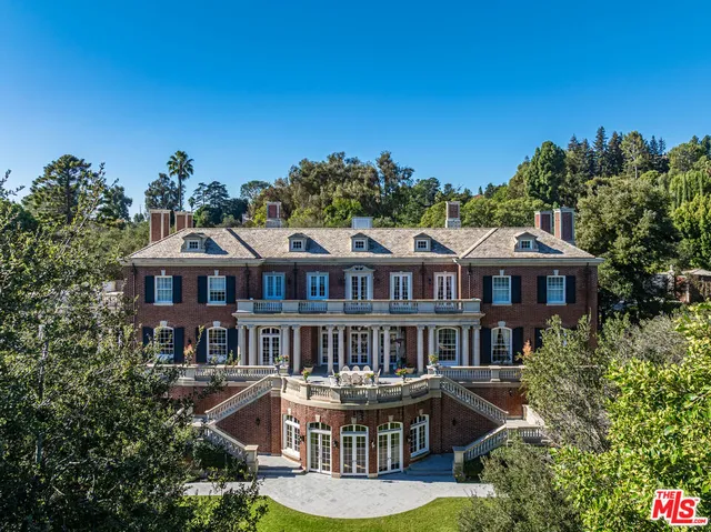 a view of a park with large trees
