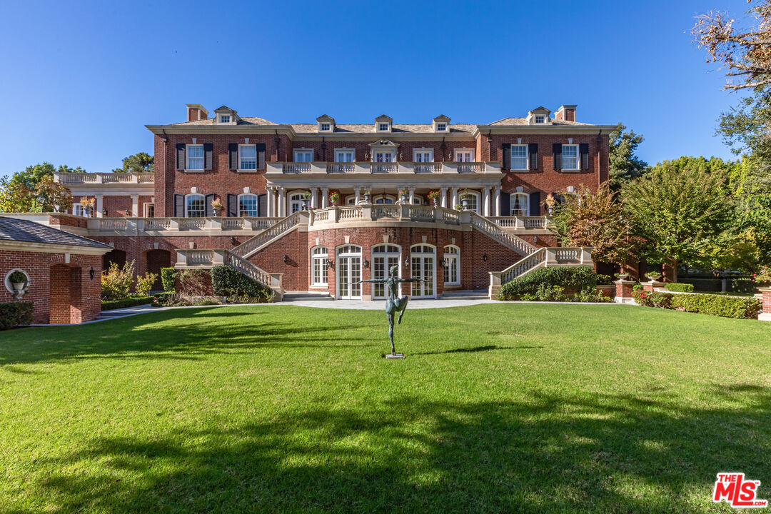 500 St Cloud Road Los Angeles, CA 90077 - Photo 40 of 59 a view of a house with a big yard next to a yard