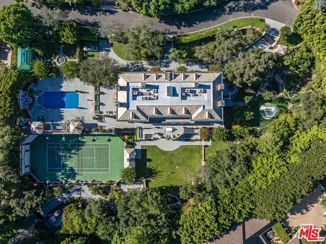 a view of a backyard with sitting area