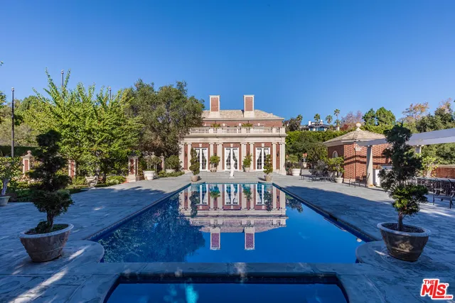 a view of a park with large trees
