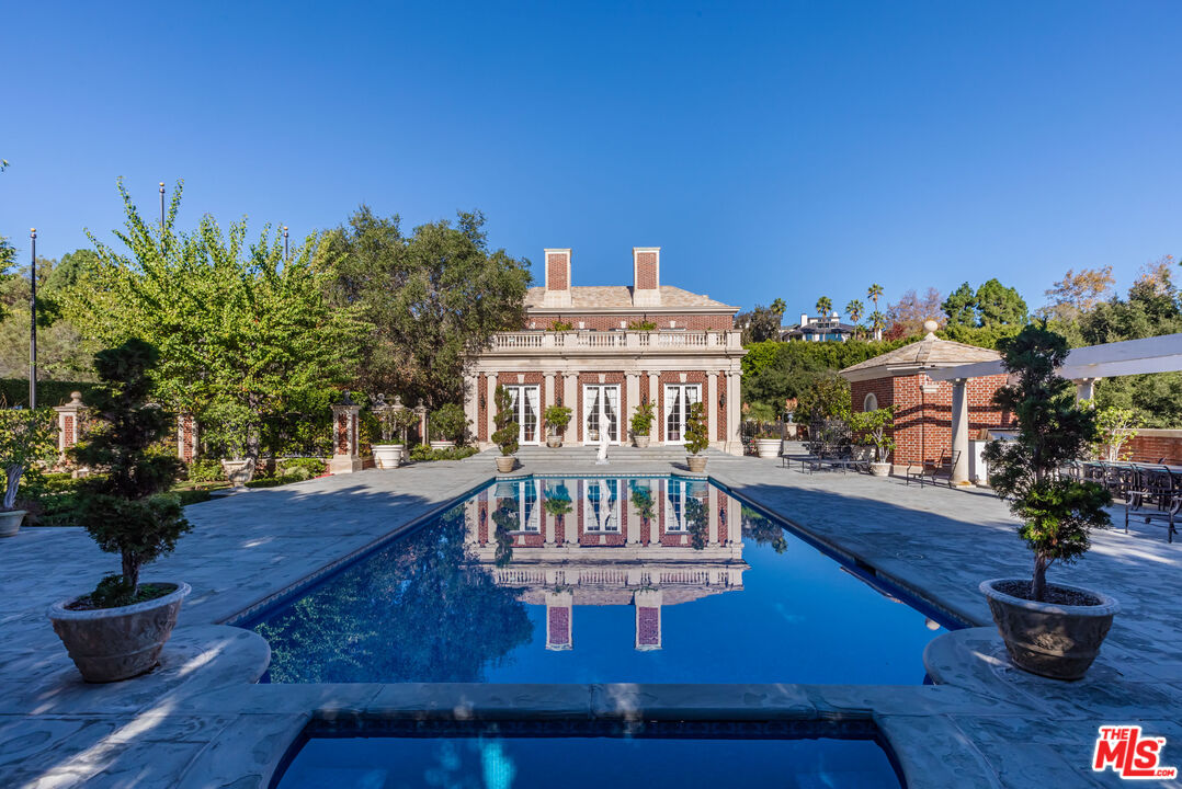 500 St Cloud Road Los Angeles, CA 90077 - Photo 48 of 59 a view of a house with backyard and sitting area