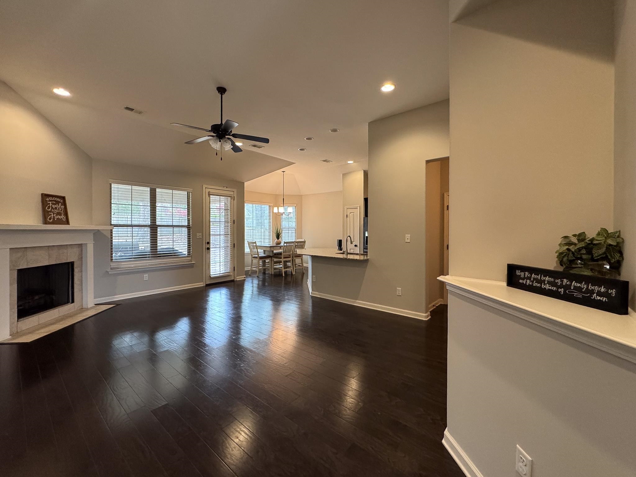 7754 Shadowcrest Road Memphis, TN 38125 - Photo 6 of 27 Living area with a tile fireplace, baseboards, recessed lighting, a ceiling fan, and dark wood-style floors