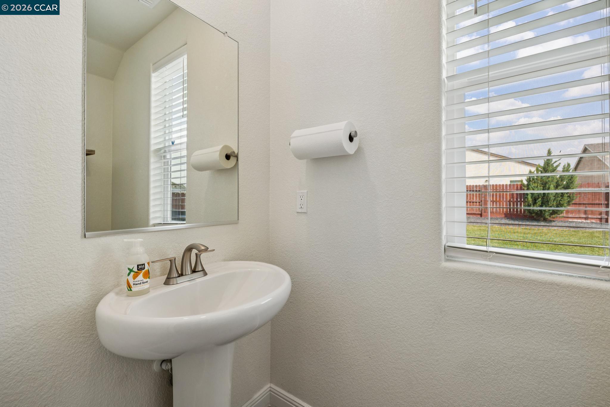 4748 Beacon Way Rio Vista, CA 94571 - Photo 13 of 35 a bathroom with a sink a mirror and a window