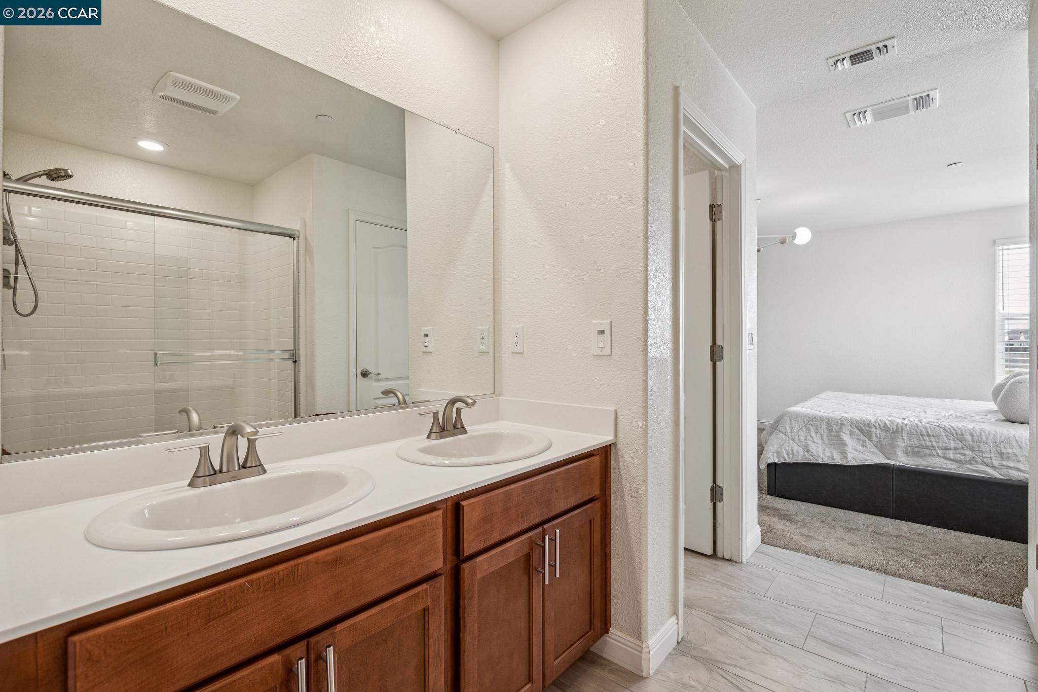 4748 Beacon Way Rio Vista, CA 94571 - Photo 19 of 35 a en suite bathroom with double sink and a mirror