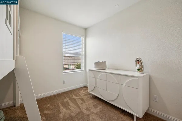 a room with a bed and a window
