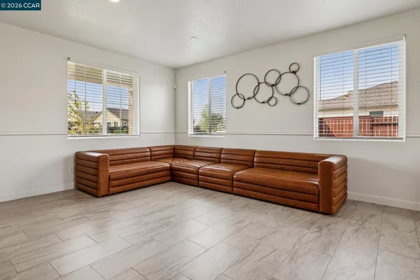 a sitting area with a couch and a window