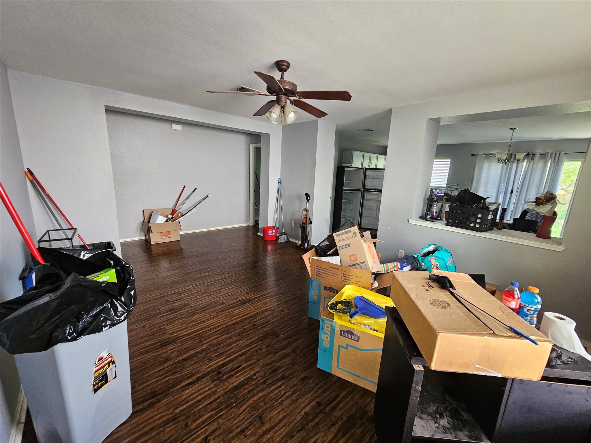 1120 Apollo Circle Round Rock, TX 78664 - Photo 12 of 14 Well-lit living area with dark flooring awaits personal touches.