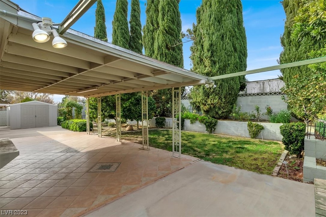 1407 Bronco Road Boulder City, NV 89005 - Photo 27 of 38 Oversized covered patio with custom tile pavers.