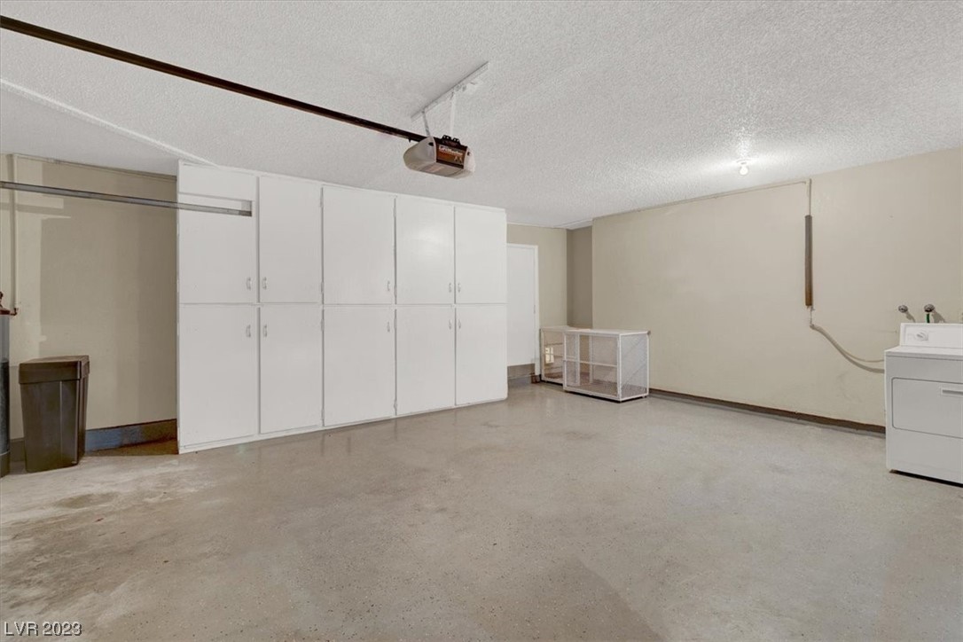 1407 Bronco Road Boulder City, NV 89005 - Photo 32 of 38 2 car garage with extra storage and epoxy floor
